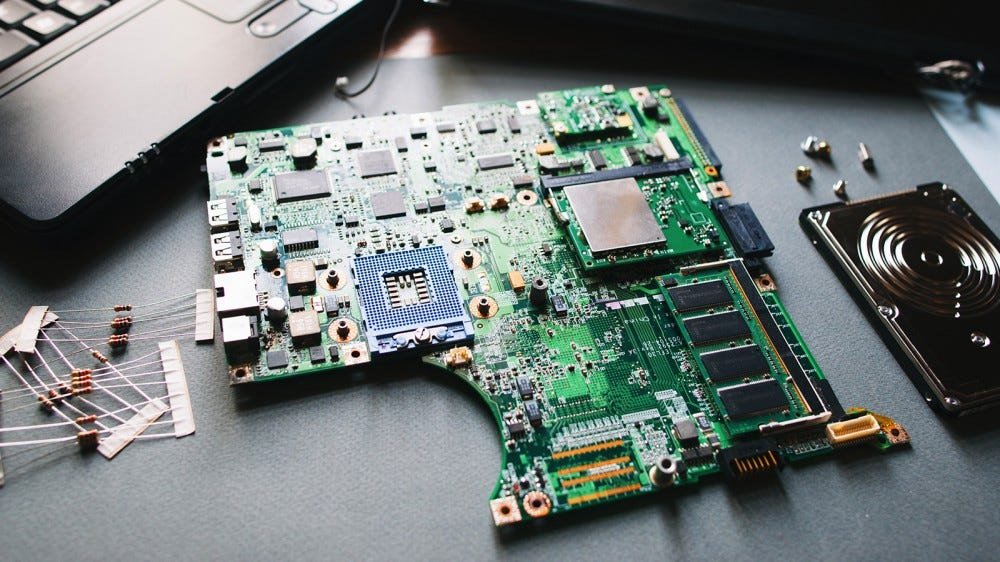 A laptop motherboard on a table.