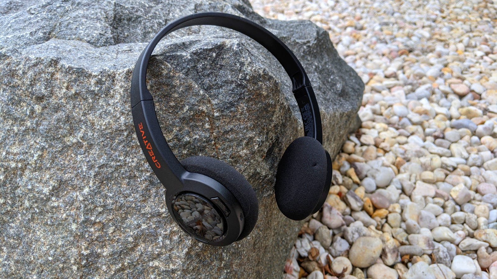 Sound Blaster Jam V2 headphones against rocky background