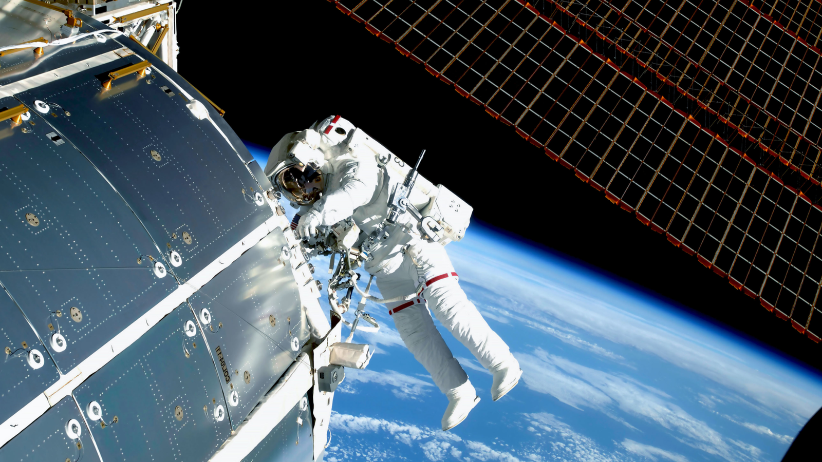 Astronaut at the International Space Station outside repairing the craft